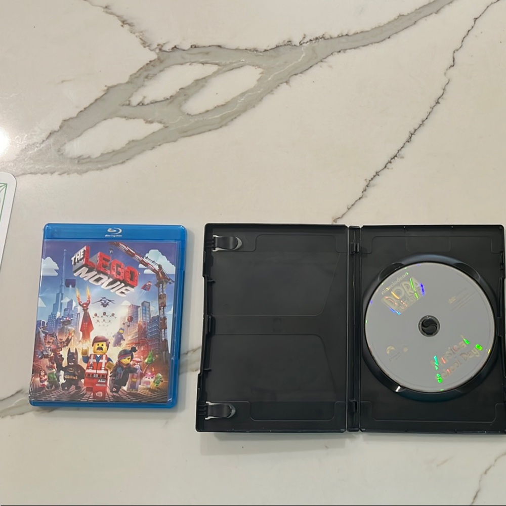 LEGO Movie Blu-ray Disc and Dora the Explorer Musical School Days Disc